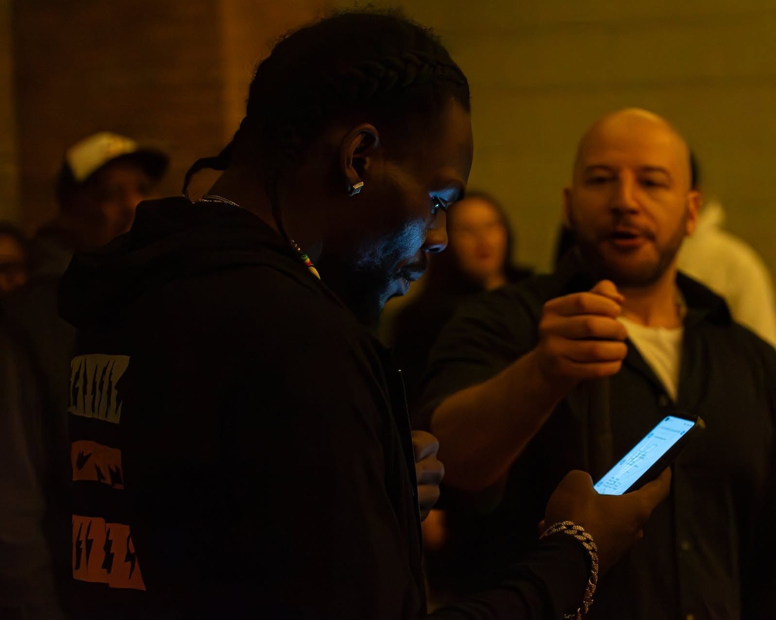 Aboog Carter backstage checking a phone