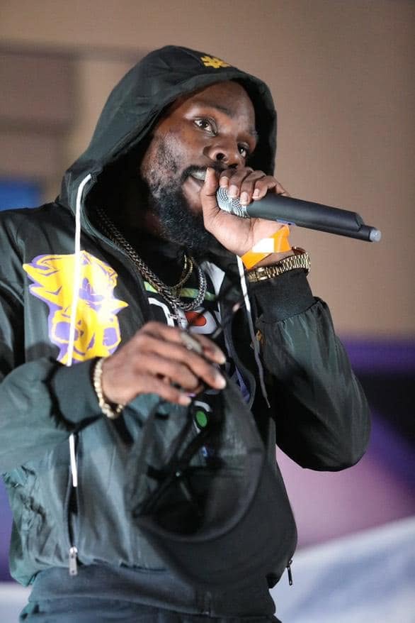 Aboog Carter performing live with a microphone
