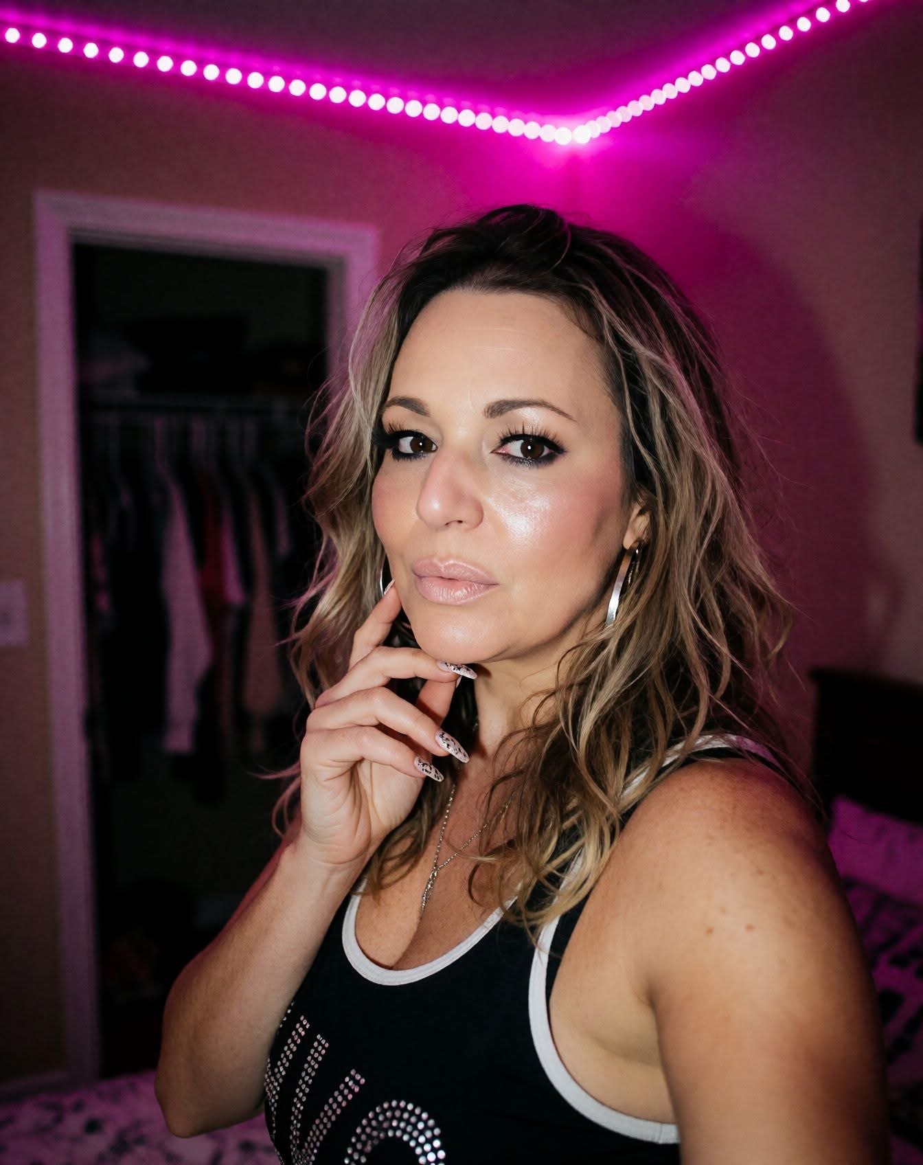 Dennyann Giambrone portrait under magenta light