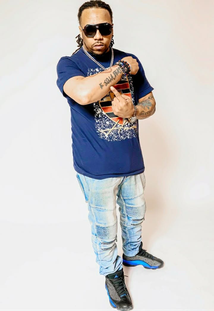 E Jilla Beats in sunglasses and a navy shirt