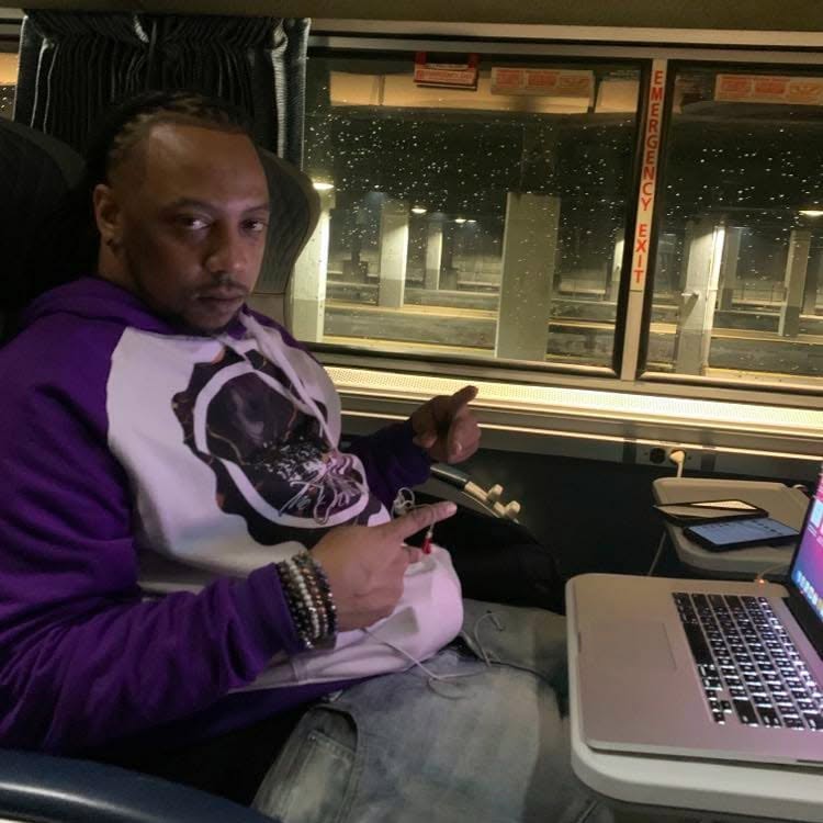 E Jilla Beats working with a laptop while traveling